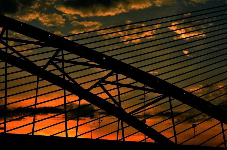 SILHOUETTE OF BUILT STRUCTURE AT SUNSET