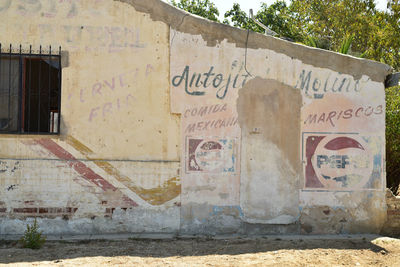 Graffiti on wall of old building