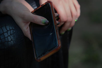 Close-up of person holding mobile phone