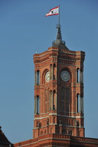 Low angle view of clock tower against sky