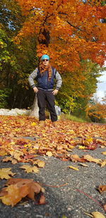 Man on maple leaves during autumn