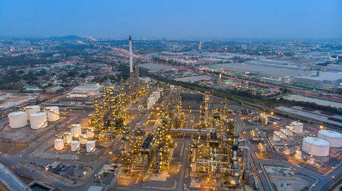 Aerial view of chemical oil refinery plant, power plant at sunset sky for industry concept.