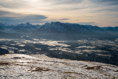 Scenic view of snowcapped mountains against sky during sunset