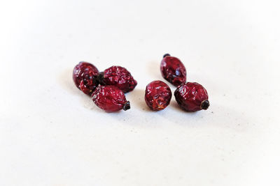 Close-up of strawberries on table against white background