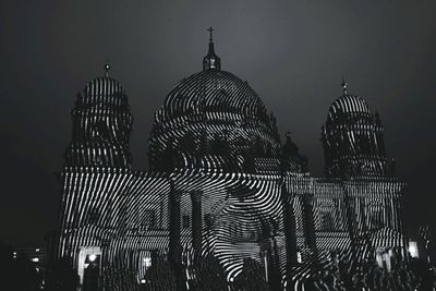 Low angle view of illuminated building at night