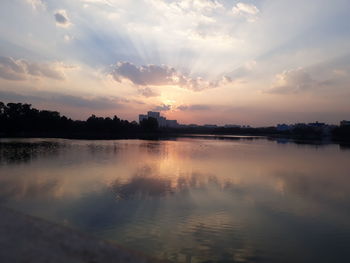 Scenic view of lake against sky during sunset