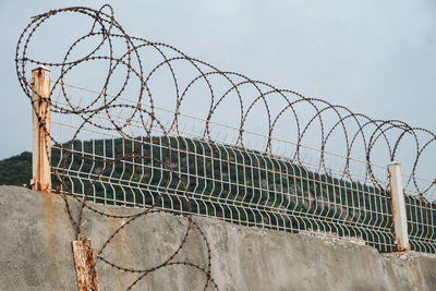 Chainlink fence against sky