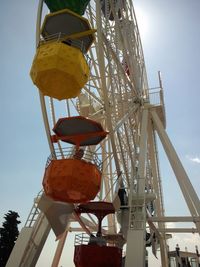 Low angle view of ferris wheel against sky