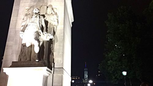 Low angle view of statue at night