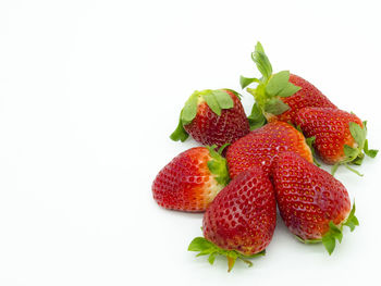 Close-up of strawberries against white background