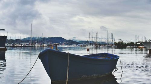 Boats moored at harbor