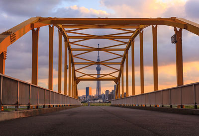 View of bridge against cloudy sky