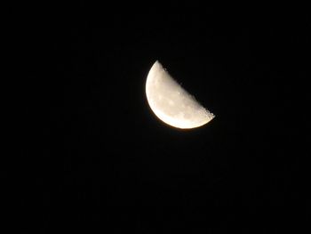 Low angle view of moon against sky at night