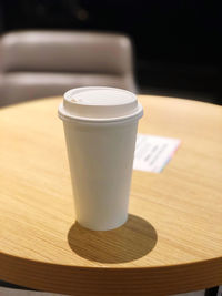 Close-up of coffee cup on table