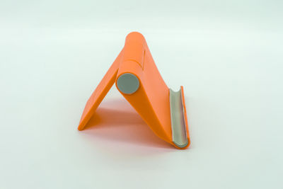 Close-up of yellow toy against white background