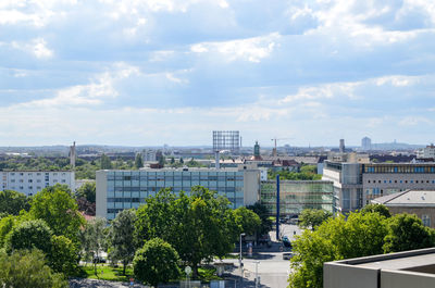 Buildings against cloudy sky