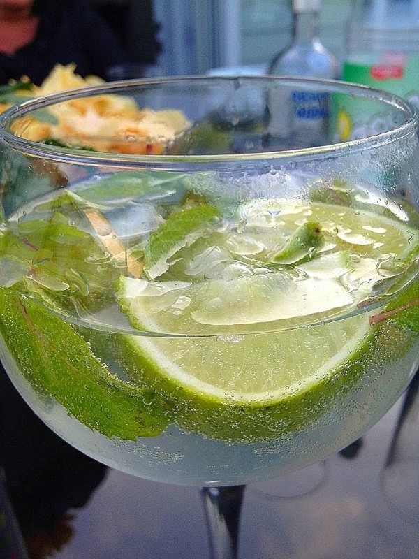 indoors, close-up, freshness, food and drink, glass - material, drinking glass, drink, focus on foreground, refreshment, green color, transparent, still life, selective focus, glass, table, healthy eating, leaf, no people, water, bubble