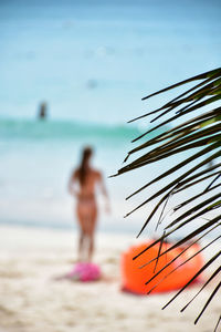 Tourists are enjoying beachside relaxation and swimming in phuket beach thailand.