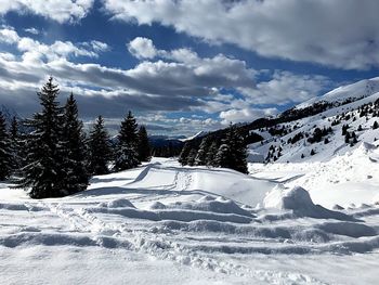 Scenic view of snowcapped mountains against sky