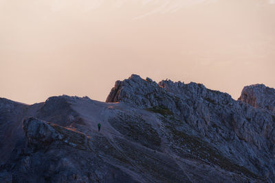 Scenic view of rocky mountains against sky during sunset