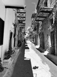 Narrow street amidst buildings in city
