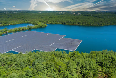 Aerial view of solar panels in lake