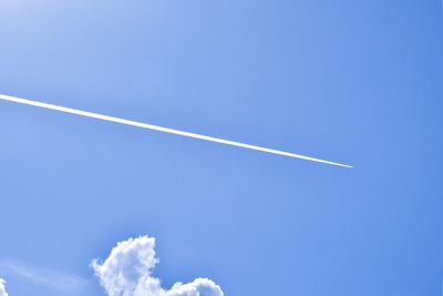 Low angle view of vapor trails in sky