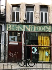 Bicycles on footpath against building