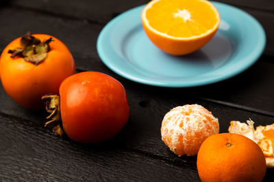 Close-up of orange fruits on table