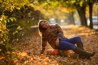 Young woman sitting on field