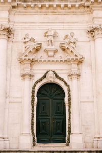 Low angle view of statue against building