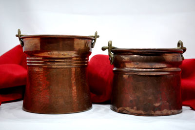 Close-up of containers against white background