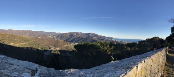 Scenic view of landscape against blue sky