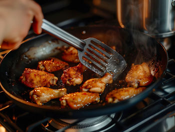 Cropped hand preparing food