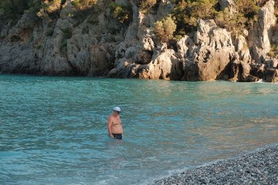 Man swimming in sea