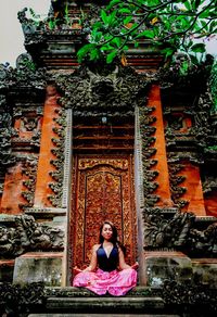 Portrait of woman sitting in temple