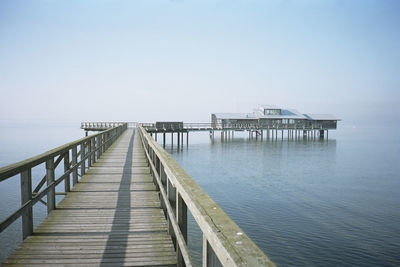 Empty wooden pier and blue sky