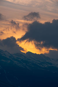 Scenic view of mountains against sky during sunset