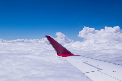 Low angle view of airplane flying against sky