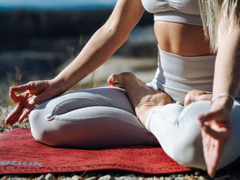 Midsection of women relaxing outdoors
