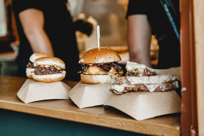 Burgers at a burger feast. dinner hamburger food feast party. big burger at street food outdoor