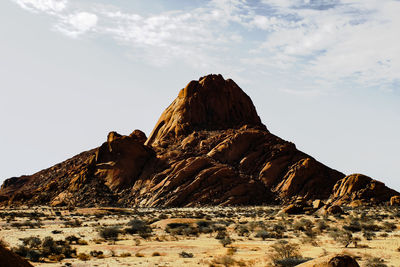 Panoramic view of rock formations against sky