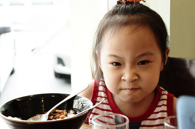 Portrait of cute girl in bowl