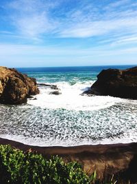 Scenic view of sea against cloudy sky