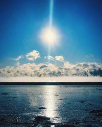 Scenic view of sea against blue sky