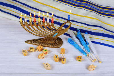 Close-up of colorful candles on table during hanukkah