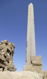 Low angle view of historical building against blue sky