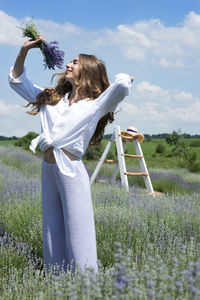 Full length photo of a girl in the lavender field