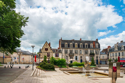 Buildings in city against sky