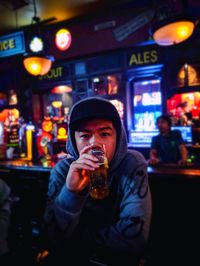 Portrait of a man drinking glass